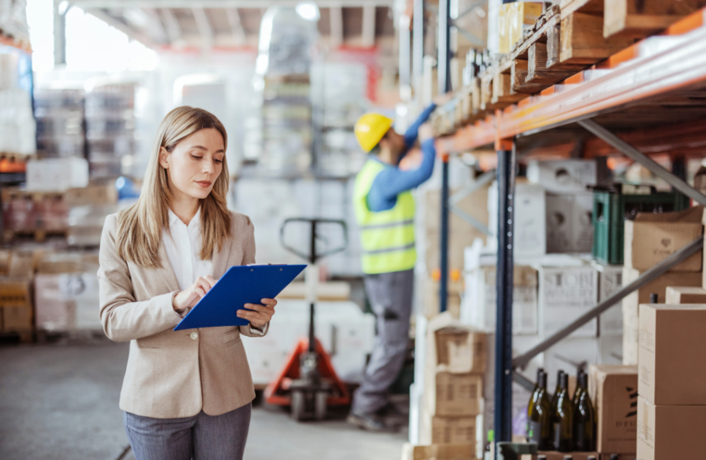 Compliance officer checking boxes on a checklist in a tidy worksite.