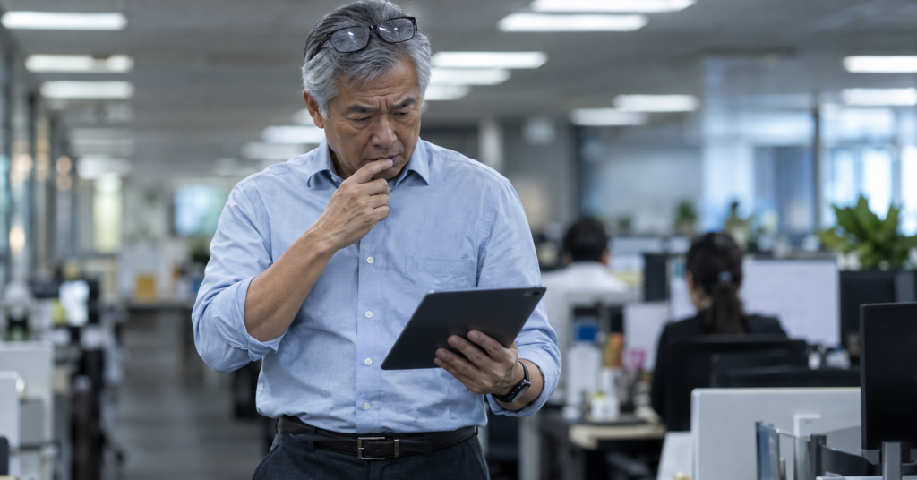 Employer reviewing employee personnel records for compliance gaps